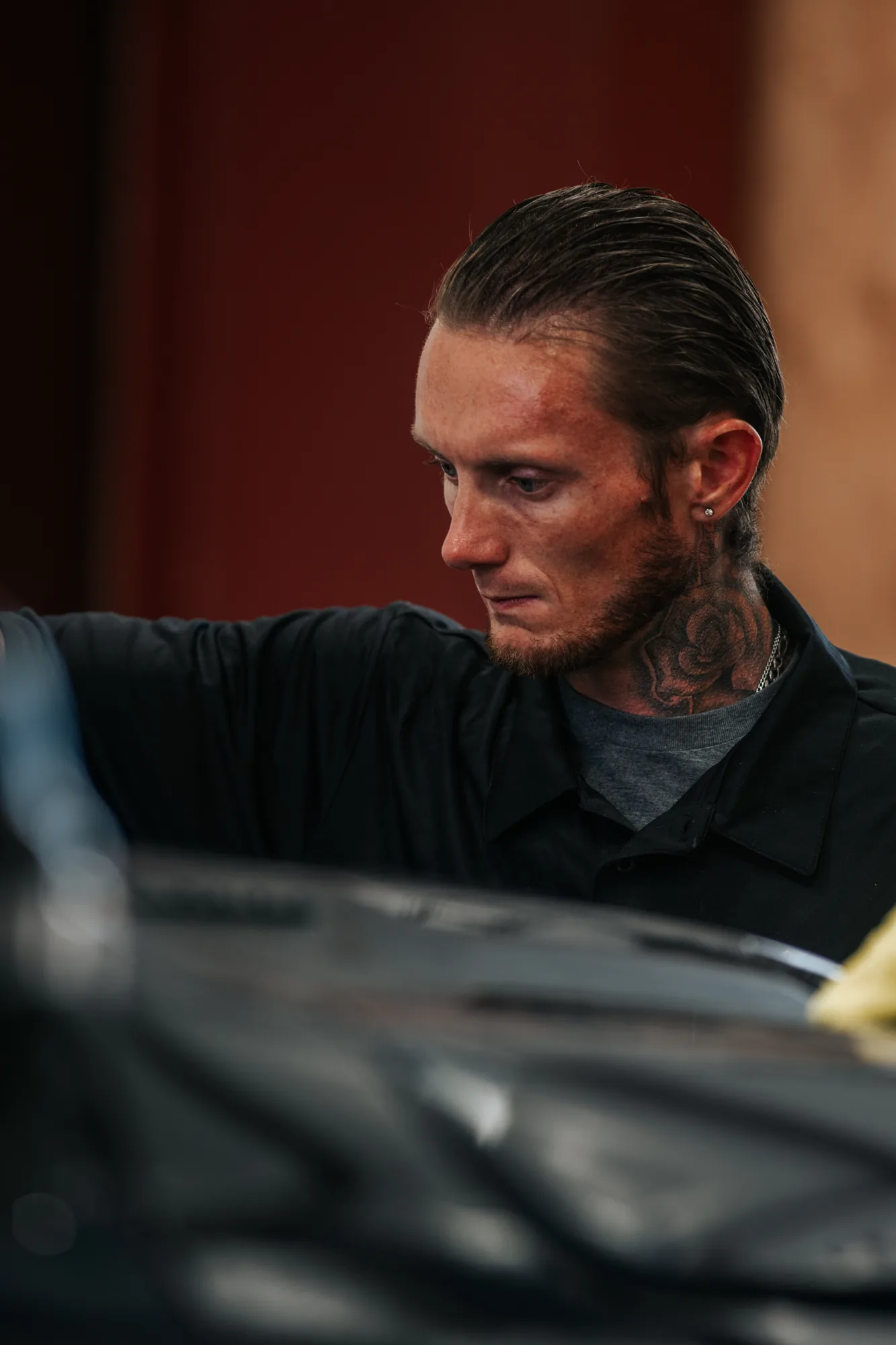 Shallow depth of field portrait across the hood of a truck, vintage Canon 300mm