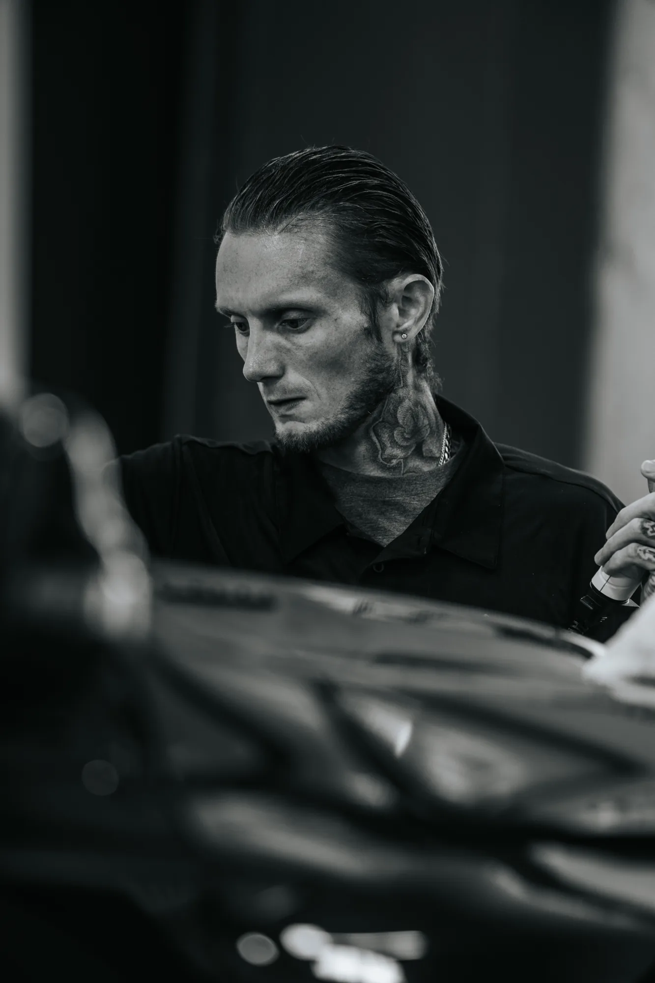 Black and white portrait of a tint installer at work, Canon FD 300mm f/2.8 L