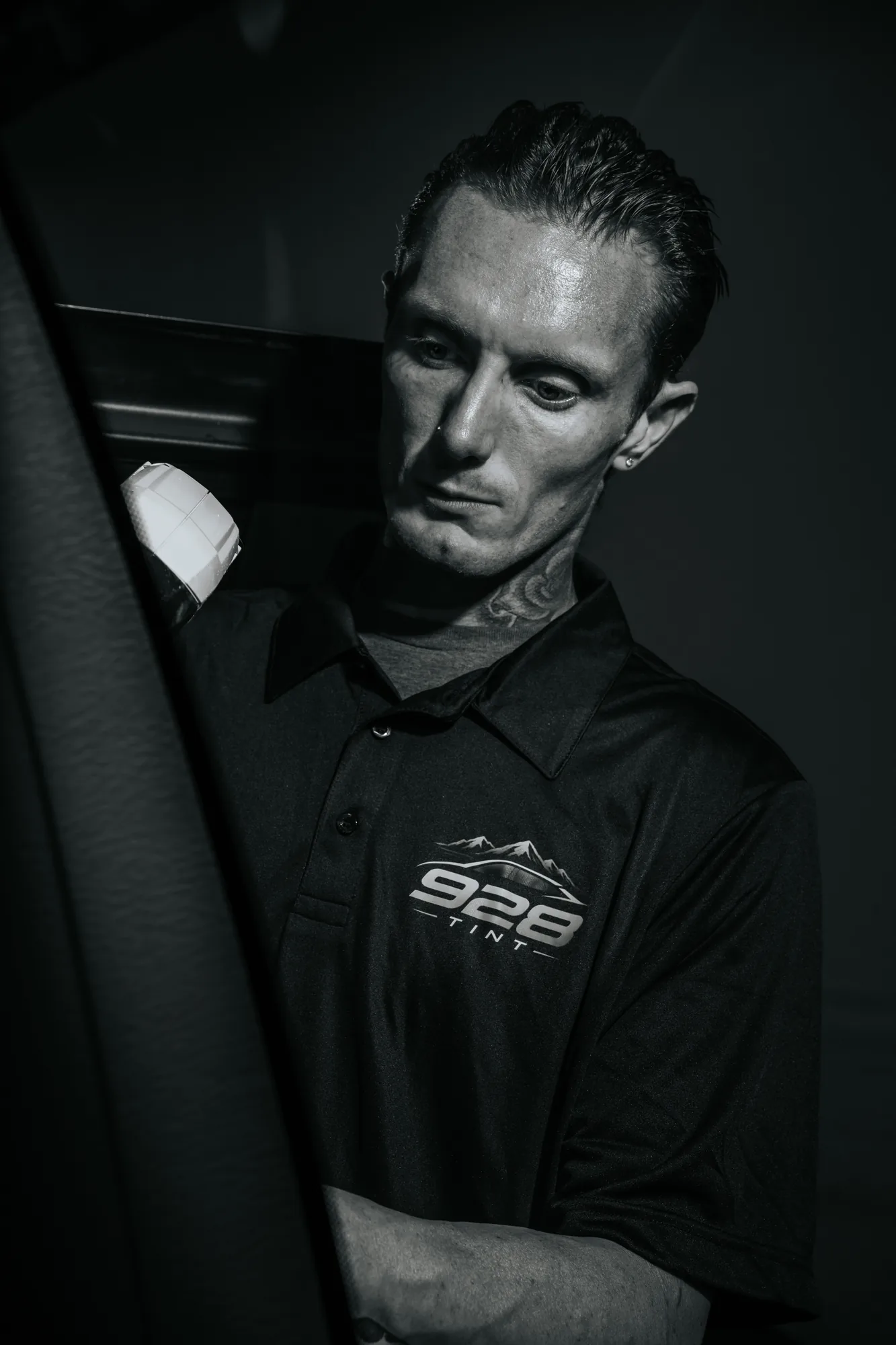 Black and white portrait of Jonny Martin in his 928 Tint shirt