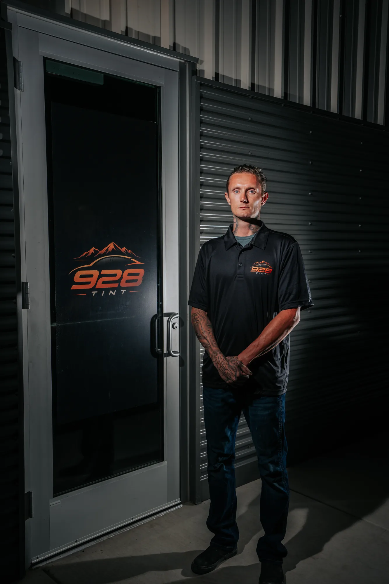 Jonny Martin standing at the front door of the 928 Tint shop in Prescott Valley, Arizona