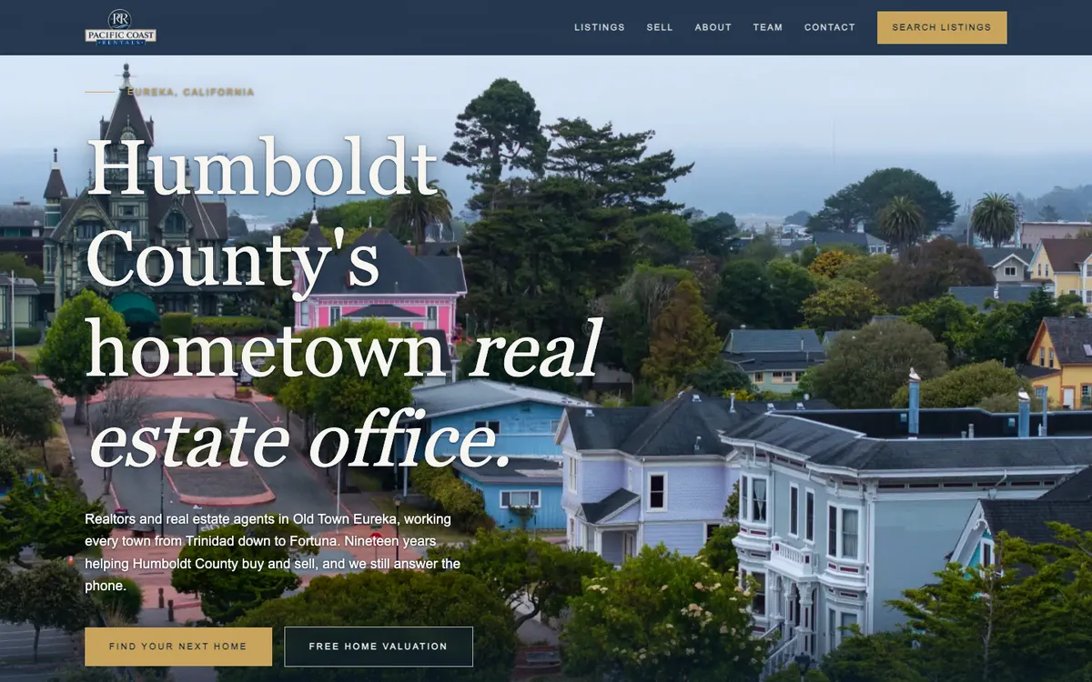 Pacific Coast Realty homepage over an aerial photo of Eureka's Victorian homes