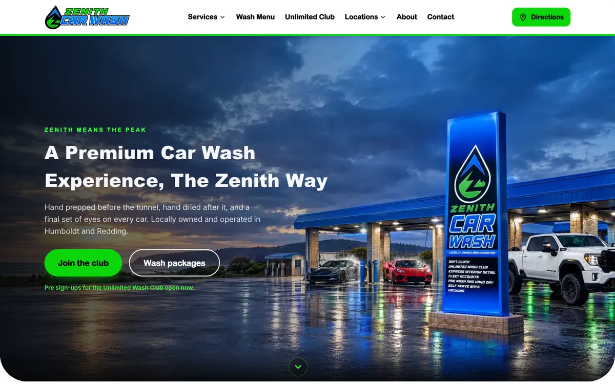 Zenith Car Wash homepage with the lit sign and wash bays at dusk