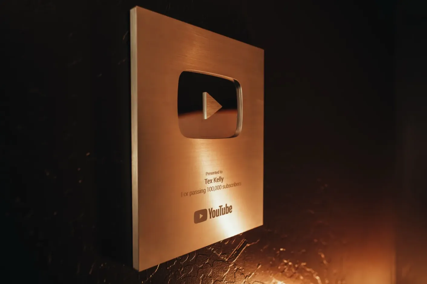 YouTube Silver Creator Award presented to Tex Kelly for passing 100,000 subscribers