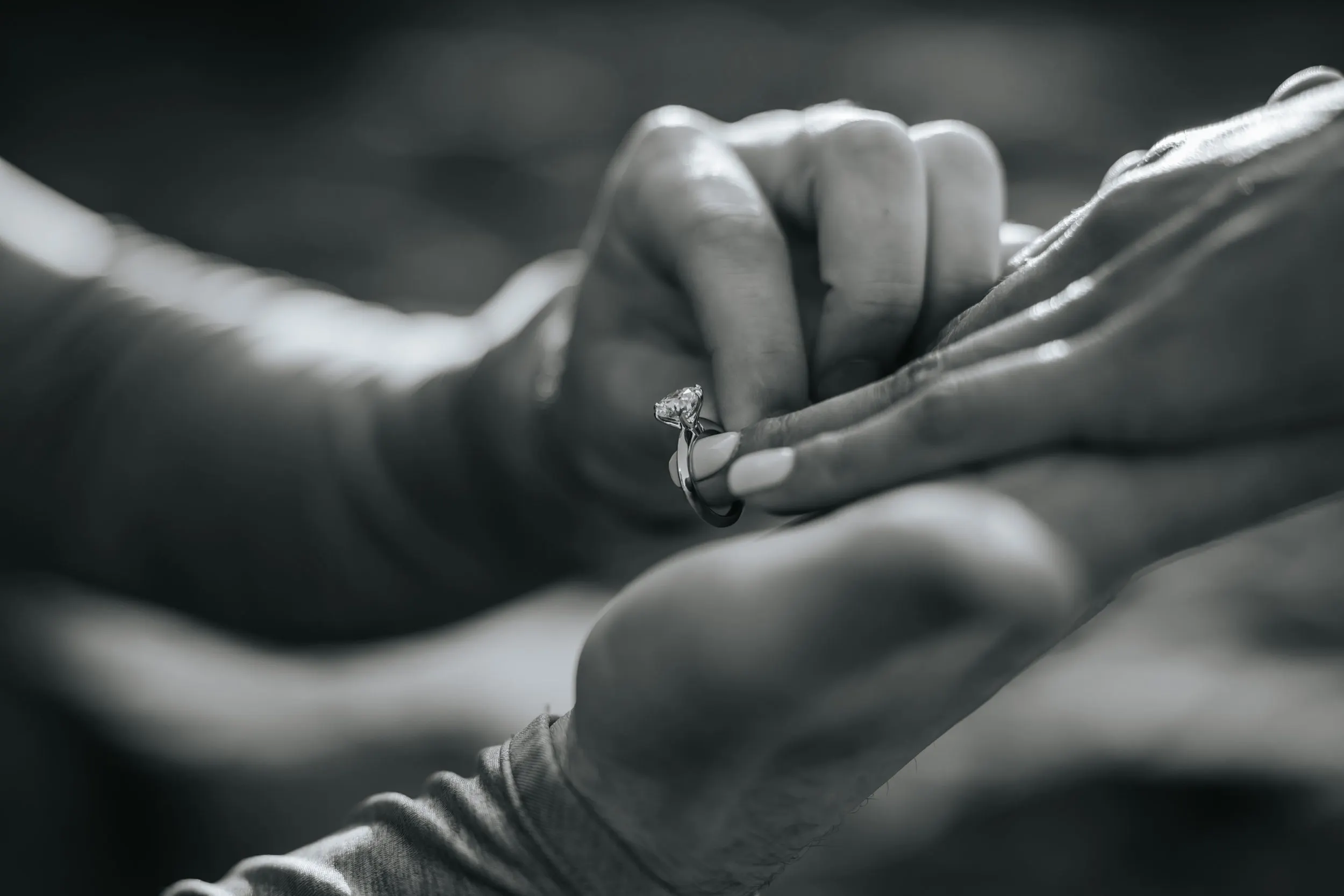 Newly engaged couple kissing at golden hour