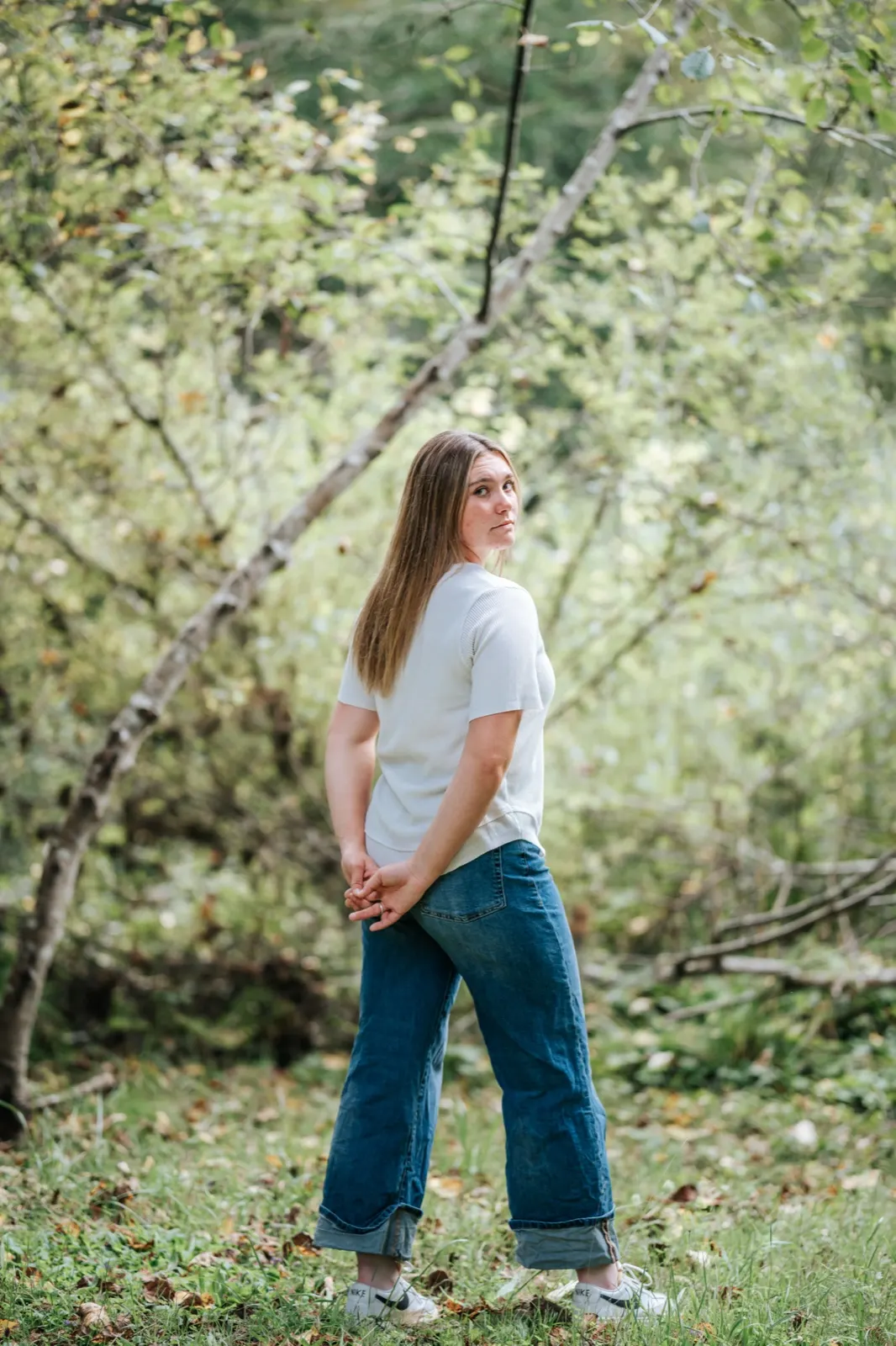 Outdoor senior portrait at sunset on a bluff