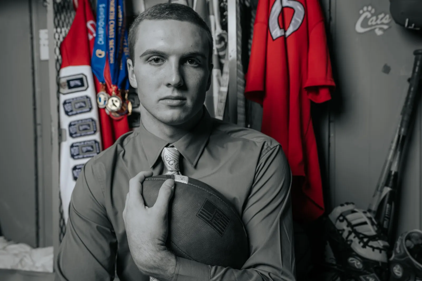 Senior in athletic uniform, recruitment-style portrait