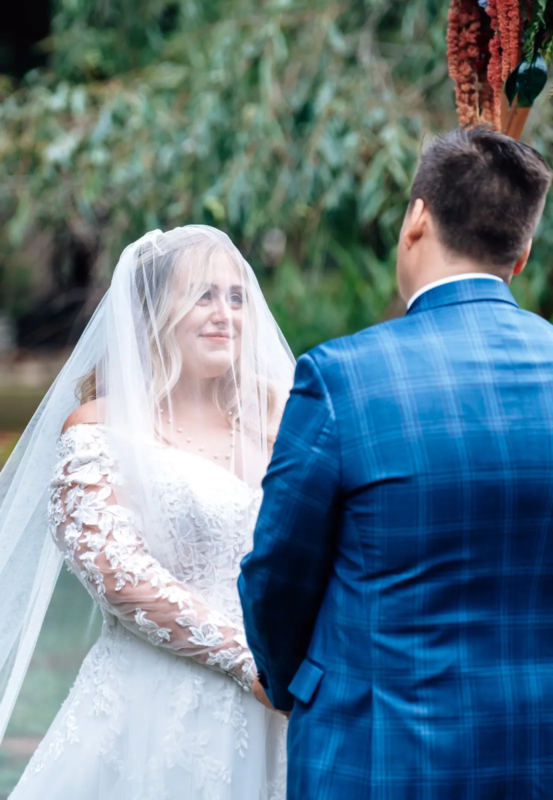 First-look moment between bride and groom in soft natural light
