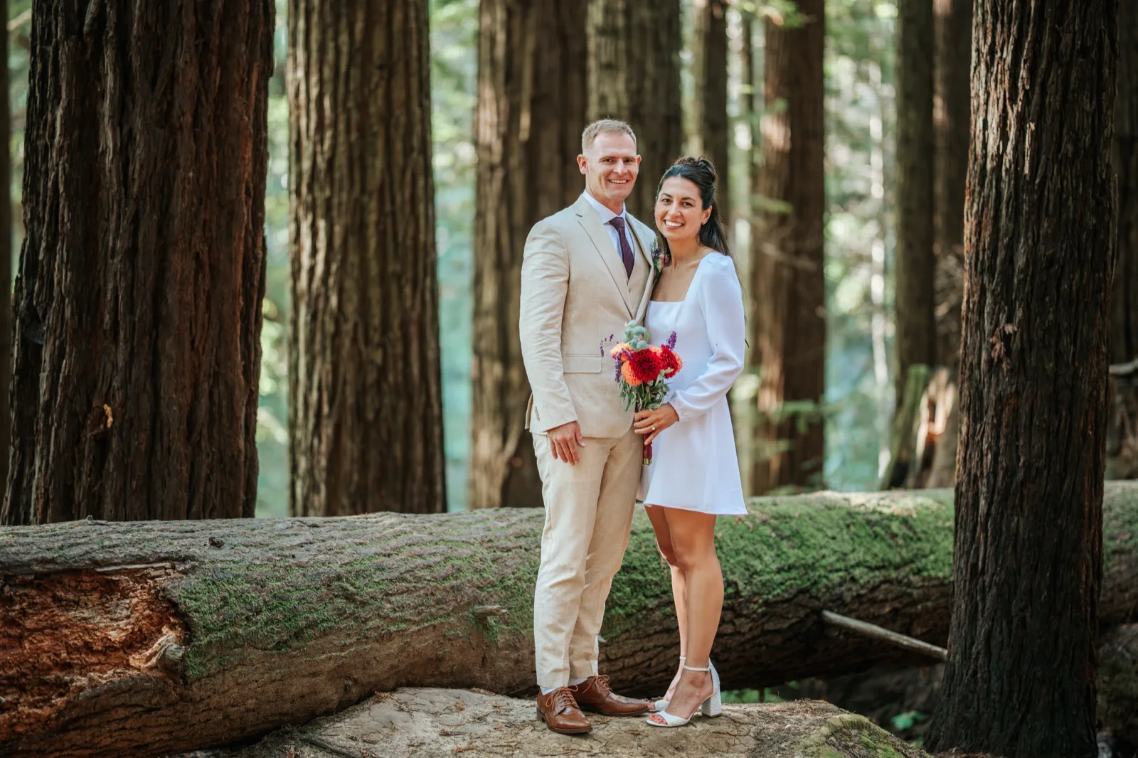 Sofia and Cam, elopement portrait on a fallen redwood, Humboldt County wedding photographer